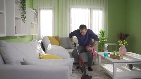 A-mature-man-cleans-his-house,-applying-hygiene-rules-for-a-clean-house.